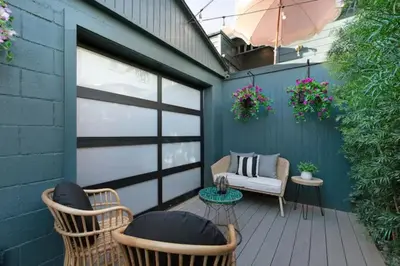 a patio with chairs and a couch and a table at Quaint Studio for 2 in the Heart of Little Italy in San Diego