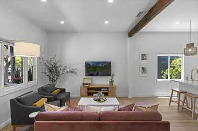 a living room with a couch and a table at 4BD Home in the Heart of Little Italy in San Diego