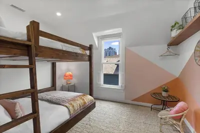a bedroom with two bunk beds and a window at 4BD Home in the Heart of Little Italy in San Diego