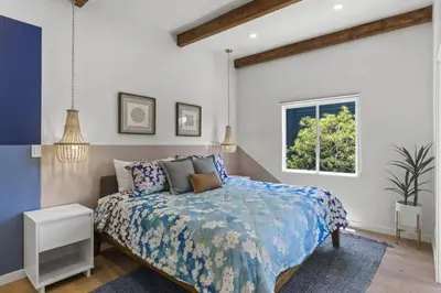 a bedroom with a bed and a window at 4BD Home in the Heart of Little Italy in San Diego