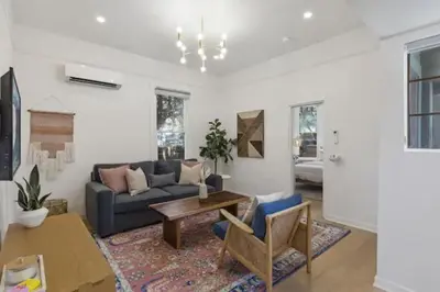 a living room with a couch and a table at Cozy 1 BR Casita Overflowing with Natural Light in San Diego