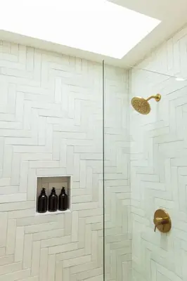 a bathroom with a shower with three black bottles at Bright, Spacious 4 BD in the Heart of Little Italy in San Diego