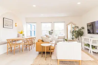 a living room with a couch and a table at Bright, Spacious 4 BD in the Heart of Little Italy in San Diego