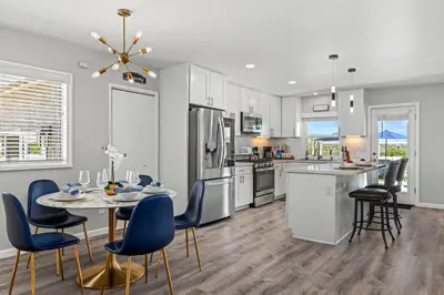 a kitchen and dining room with a table and chairs at The Sky Lounge in La Mesa