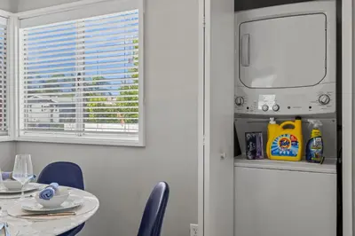 a dining room with a table and a window at The Sky Lounge in La Mesa