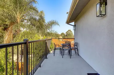 a balcony with chairs and a table on it at 2 Mi to Downtown Escondido Apt with Balconies in Escondido
