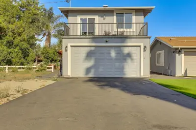 a house with a garage in front of it at 2 Mi to Downtown Escondido Apt with Balconies in Escondido