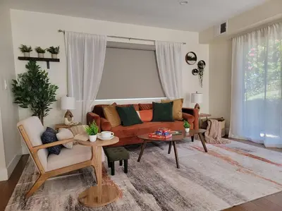 a living room with a couch and a table at San Diego Oasis with Hot Tub, Gym, Outdoor Theater, Huge Yard in San Diego