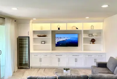 a living room with a tv and white cabinets at Irvine Luxury 2Bedroom 2Bathroom Portola Springs in East Irvine