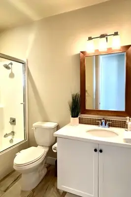 a bathroom with a toilet and a sink and a mirror at Irvine Luxury 2Bedroom 2Bathroom Portola Springs in East Irvine