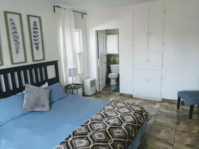 a bedroom with a bed and a bathroom with a toilet at Centrally Located 2 Master Bedrooms to Explore all San Diego has to Offer in San Diego