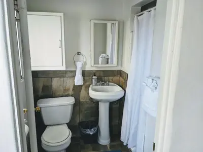 a bathroom with a toilet and a sink at Centrally Located 2 Master Bedrooms to Explore all San Diego has to Offer in San Diego