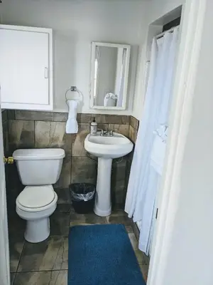 a bathroom with a toilet and a sink at Centrally Located 2 Master Bedrooms to Explore all San Diego has to Offer in San Diego