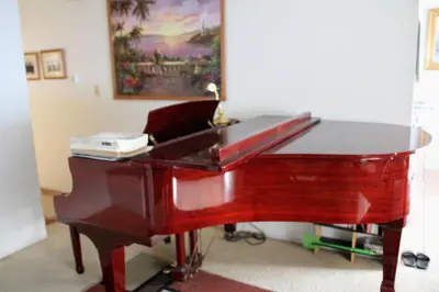 a red piano sitting in a living room at A Bridge to All San Diego Central Pool Home Private Room in San Diego
