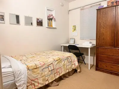 a bedroom with a bed and a desk at A Bridge to All San Diego Central Pool Home Private Room in San Diego