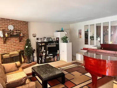 a living room with a couch and a piano at A Bridge to All San Diego Central Pool Home Private Room in San Diego