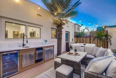 a kitchen and a living room with a table and a kitchen and sidx sidx sidx at Spectacular Seaview Oasis -Views Spa Game Room in San Diego