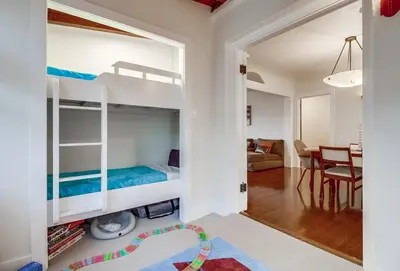 a room with two bunk beds and a dining room at Spectacular Seaview Oasis -Views Spa Game Room in San Diego