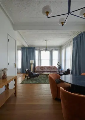 a living room with a couch and a table at Granger Hotel San Diego Downtown Gaslamp Quarter, a Member of Design Hotels in San Diego
