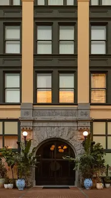 a large building with a entrance to a store at Granger Hotel San Diego Downtown Gaslamp Quarter, a Member of Design Hotels in San Diego