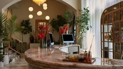 an office with a desk with two computers on it at Granger Hotel San Diego Downtown Gaslamp Quarter, a Member of Design Hotels in San Diego