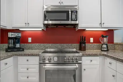 a kitchen with a stove and a microwave at Better Two-Gether 2-bed 2,5-bath in Oceanside