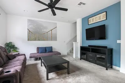 a living room with a couch and a tv at Better Two-Gether 2-bed 2,5-bath in Oceanside