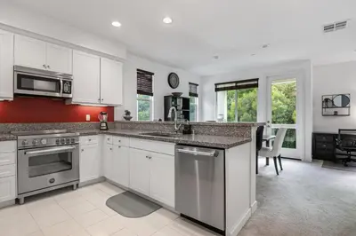 a kitchen with white cabinets and a counter top at Better Two-Gether 2-bed 2,5-bath in Oceanside