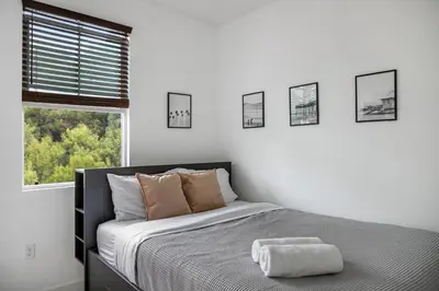 a white bedroom with a bed and a window at Better Two-Gether 2-bed 2,5-bath in Oceanside