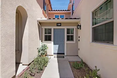 a house with a blue door and a walkway at Fun In The Sun 2 Bed 2 Bath Home in Oceanside