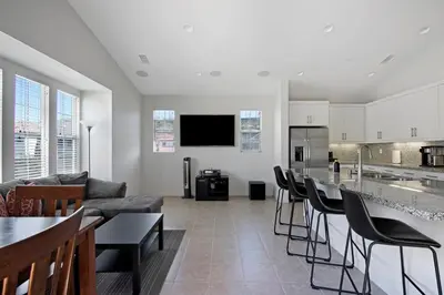 a kitchen and living room with a couch and a table at Fun In The Sun 2 Bed 2 Bath Home in Oceanside