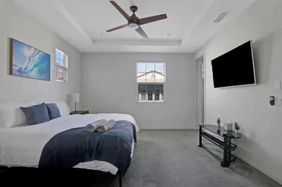 a bedroom with a bed and a ceiling fan at Fun In The Sun 2 Bed 2 Bath Home in Oceanside