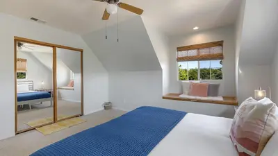 a bedroom with a bed and a mirror and a bathroom at Wine Country Retreat Gorgeous Views Minutes to Wineries in Temecula