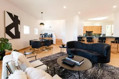a living room with a couch and a table at La Jolla Ocean View Mansion 2 in San Diego
