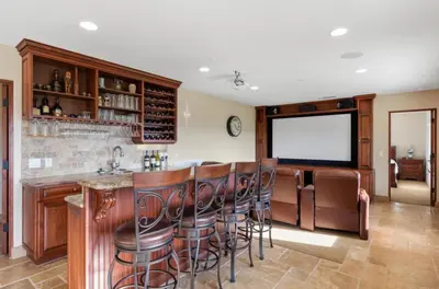 a bar with wooden stools in a room at Breathtaking Retreat in Escondido