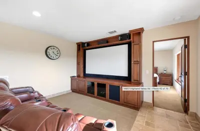 a living room with a couch and a flat screen tv at Breathtaking Retreat in Escondido