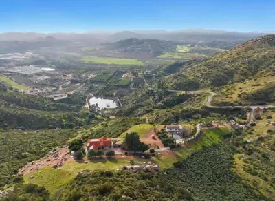an aerial view of a valley with a house on a hill at Breathtaking Retreat in Escondido