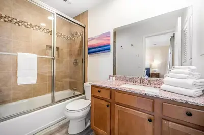 a bathroom with a toilet and a sink and a shower at Charming Home Just Steps from the Beach 2 Bedroom, Private Back Patio, & Free WiFi in Newport Beach