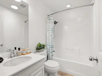 a bathroom with a sink and a toilet and a shower at Irvine Inn Love - Lovely Furnished 3-bed Home in Woodbury in Irvine