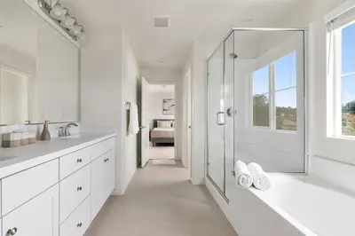 a white bathroom with a shower and a bath tub at Sunnyside Up San Diego Gem in San Diego