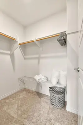 a walk in closet with white towels and a basket at Sunnyside Up San Diego Gem in San Diego