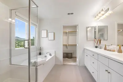 a white bathroom with two sinks and a shower at Sunnyside Up San Diego Gem in San Diego
