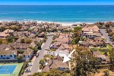 an aerial view of a residential suburb with a tennis court at Enchanting French Inspired Chateau with Beach Club! in South Oceanside