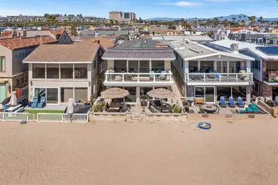 an aerial view of a house on the beach at 8BR Beach Duplex with Ocean Views, Patio & Pool Table in Newport Beach