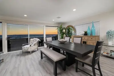 a dining room with a table and chairs at Spacious 5BR Beach Home with Ocean Views in Newport Beach