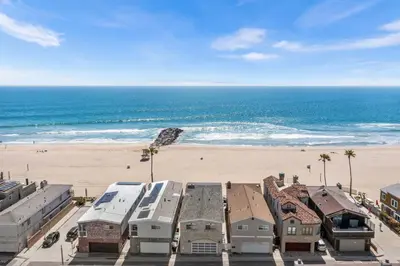 an aerial view of a beach with houses and the ocean at Spacious 5BR Beach Home with Ocean Views in Newport Beach