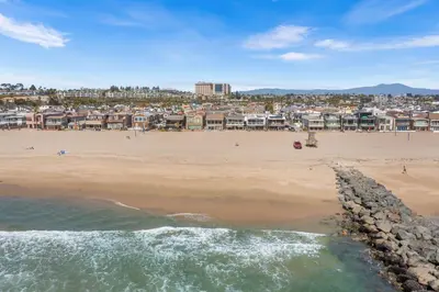 a view of a beach with people and buildings at Spacious 5BR Beach Home with Ocean Views in Newport Beach