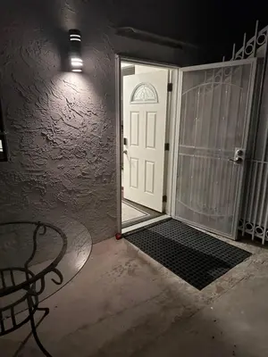 a door to a room with a table and a bench at Fabulous Guesthouse in Mount Helix La Mesa in Grossmont