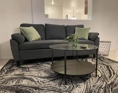 a living room with a couch and a table at Cozy Pet-Friendly Residence in Menifee
