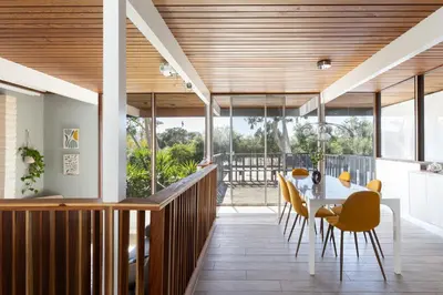 a dining room and kitchen with a table and chairs at Mid-Century Masterpiece Tree house, Pool & Spa in Escondido